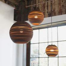 Load image into Gallery viewer, Moon Pendant Light in living room.
