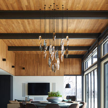 Load image into Gallery viewer, Rock Crystal LED Pendant Light in living room.
