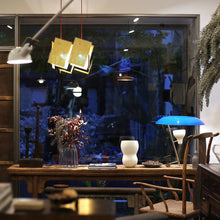 Load image into Gallery viewer, 24 Karat Blau Pendant Light in living room.
