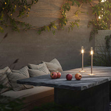 Load image into Gallery viewer, Glim Outdoor LED Portable Table Lamp in Outside Area.
