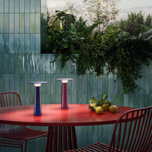 Load image into Gallery viewer, Lix Outdoor LED Portable Table Lamp in Outside Area.
