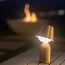 Load image into Gallery viewer, Guy Indoor/Outdoor LED Table Lamp in Outside Area.
