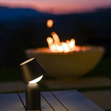 Load image into Gallery viewer, Guy Indoor/Outdoor LED Table Lamp in Outside Area.
