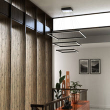 Load image into Gallery viewer, Piazza LED Chandelier in living room.
