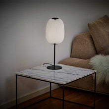 Load image into Gallery viewer, Lamella Table Lamp in living room.
