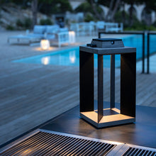 Load image into Gallery viewer, Blade Outdoor Solar LED Lantern in Outside Area.
