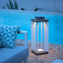 Load image into Gallery viewer, Blade Outdoor Solar LED Lantern in Outside Area.
