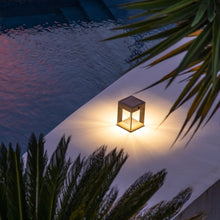 Load image into Gallery viewer, Blade Outdoor Solar LED Table Lamp in Outside Area.

