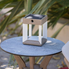 Load image into Gallery viewer, Blade Outdoor Solar LED Table Lamp in Outside Area.
