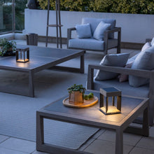 Load image into Gallery viewer, Blade Outdoor Solar LED Table Lamp in Outside Area.

