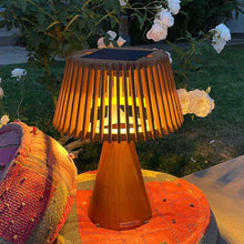 Load image into Gallery viewer, Enoki Outdoor Solar LED Table Lamp in Outside Area.
