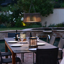 Load image into Gallery viewer, Muse Pendulum Outdoor Solar LED Pendant Light in Outside Area.
