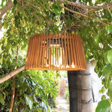 Load image into Gallery viewer, Muse Pendulum Outdoor Solar LED Pendant Light in Outside Area.
