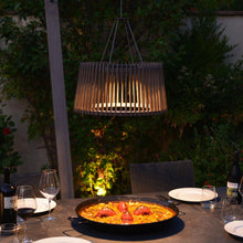 Load image into Gallery viewer, Muse Pendulum Outdoor Solar LED Pendant Light in Outside Area.
