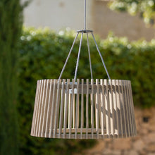 Load image into Gallery viewer, Muse Pendulum Outdoor Solar LED Pendant Light in Outside Area.
