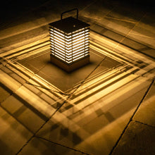 Load image into Gallery viewer, Tekura Outdoor Solar LED Lantern in Outside Area.

