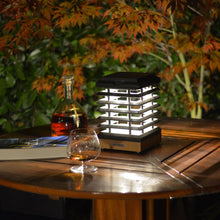 Load image into Gallery viewer, Tekura Outdoor Solar LED Table Lamp in Outside Area.
