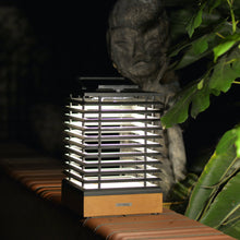 Load image into Gallery viewer, Tekura Outdoor Solar LED Table Lamp in Outside Area.
