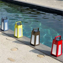 Load image into Gallery viewer, Tinka Outdoor Solar LED Lantern in Outside Area.

