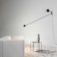 Load image into Gallery viewer, Counterbalance LED Wall Light in living room.
