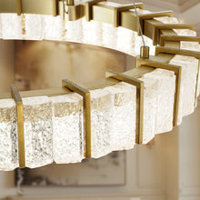 Load image into Gallery viewer, Sevryn LED Pendant Light in living room.
