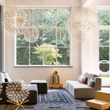 Load image into Gallery viewer, Raimond II LED Pendant Light in living room.
