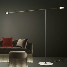 Load image into Gallery viewer, T LED Floor Lamp in living room.
