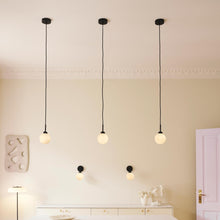 Load image into Gallery viewer, Apiales Pendant Light in living room.

