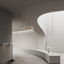 Load image into Gallery viewer, Blossi LED Chandelier in showroom.
