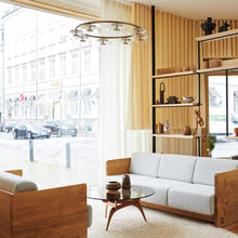 Load image into Gallery viewer, Blossi LED Chandelier in showroom.
