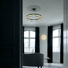 Load image into Gallery viewer, Blossi LED Chandelier in living room.
