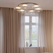 Load image into Gallery viewer, Blossi LED Chandelier in living room.
