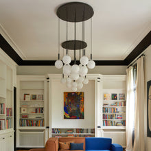 Load image into Gallery viewer, Miira Chandelier in living room.
