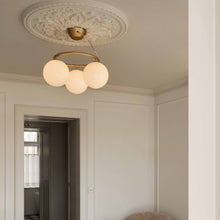 Load image into Gallery viewer, Miira Circular Chandelier in living room.
