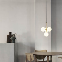 Load image into Gallery viewer, Miira Multi Pendant Light in living room.
