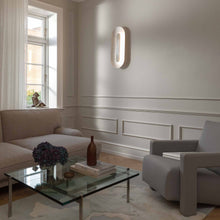 Load image into Gallery viewer, Sasi LED Wall Light in living room.
