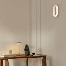 Load image into Gallery viewer, Sasi LED Wall Light in living room.
