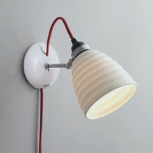 Load image into Gallery viewer, Hector Bibendum Plug-In Wall Light in Detail.
