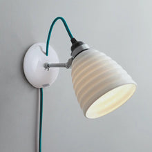 Load image into Gallery viewer, Hector Bibendum Plug-In Wall Light in Detail.
