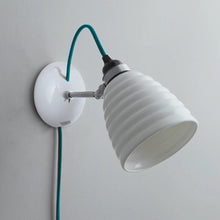 Load image into Gallery viewer, Hector Bibendum Plug-In Wall Light in Detail.
