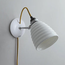 Load image into Gallery viewer, Hector Bibendum Plug-In Wall Light in Detail.
