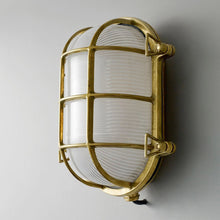 Load image into Gallery viewer, Oval Brass Bulkhead Indoor/Outdoor Wall Light in Detail.
