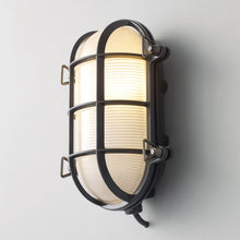 Load image into Gallery viewer, Oval Brass Bulkhead Indoor/Outdoor Wall Light in Detail.
