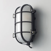 Load image into Gallery viewer, Oval Brass Bulkhead Indoor/Outdoor Wall Light in Detail.
