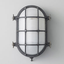 Load image into Gallery viewer, Oval Brass Bulkhead Indoor/Outdoor Wall Light in Detail.
