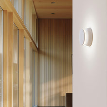 Load image into Gallery viewer, Totem Puck LED Wall Light in hallway.
