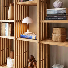 Load image into Gallery viewer, Panthella 160 LED Portable Table Lamp in living room.
