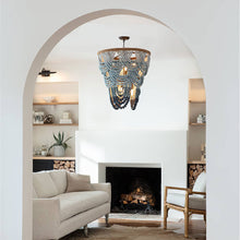 Load image into Gallery viewer, Coastal Living Ombre Chandelier in living room.
