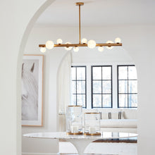 Load image into Gallery viewer, Styx Chandelier in living room.
