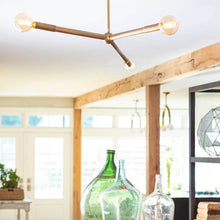 Load image into Gallery viewer, Talon Chandelier in living room.
